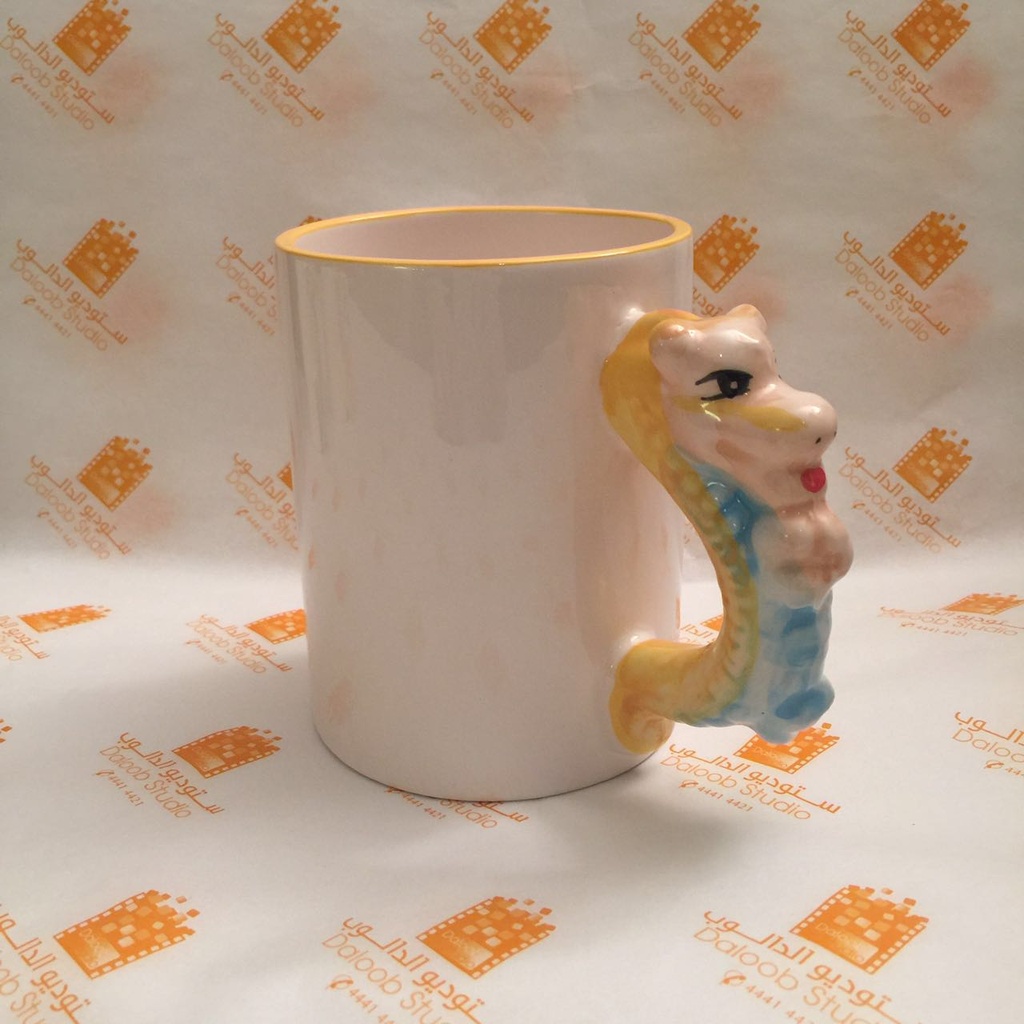 Ceramic mug with dragon shaped handle