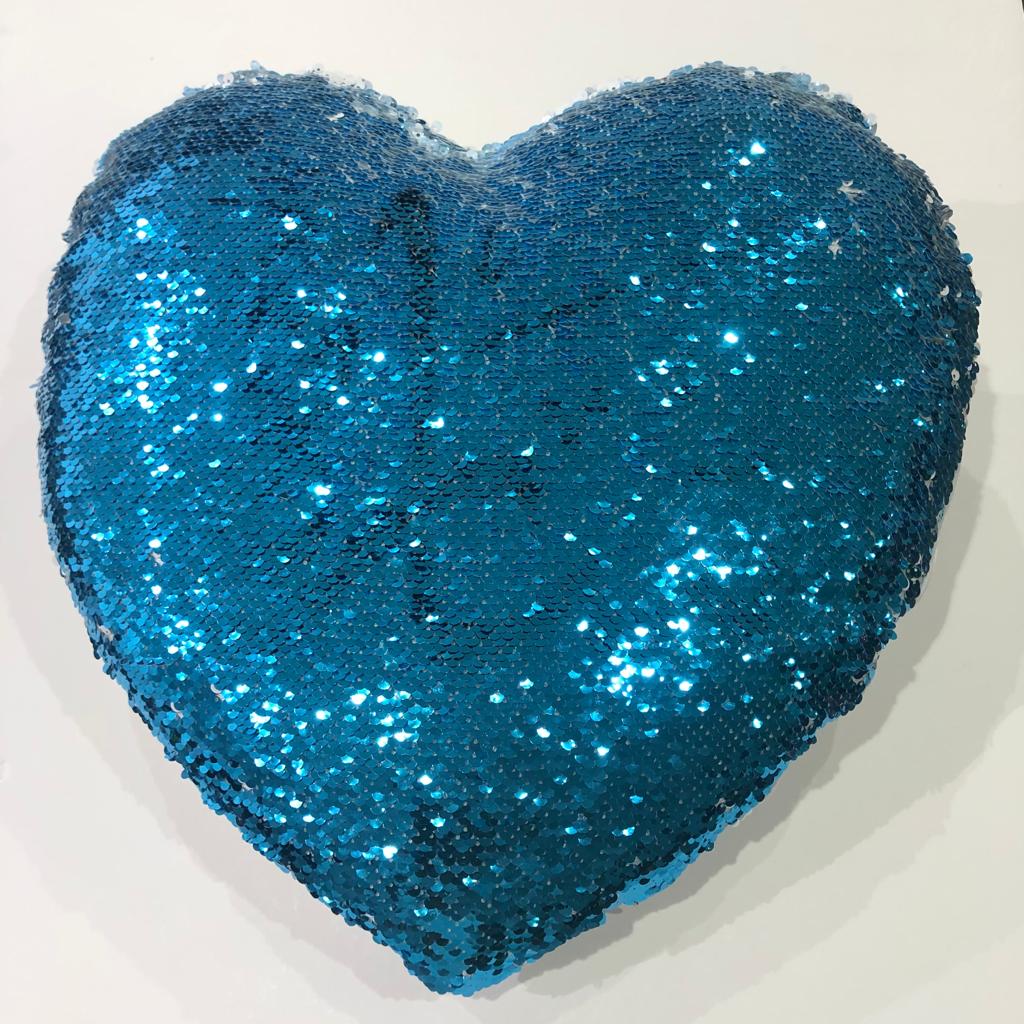 sequin pillow in the shape of a light blue heart, printed on it as desired